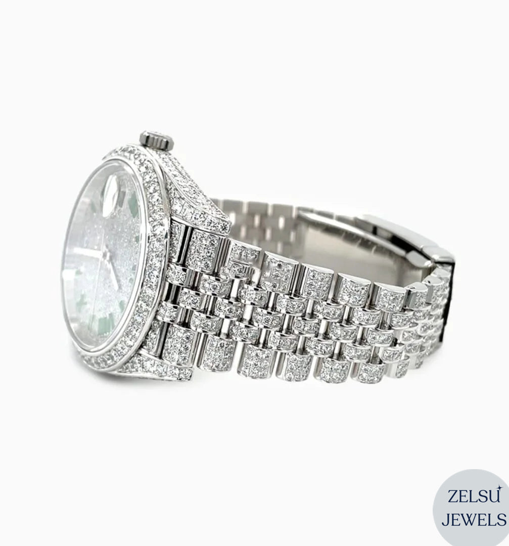 Sophisticated silver diamond watch with radiant green emerald diamonds for a luxurious finish.