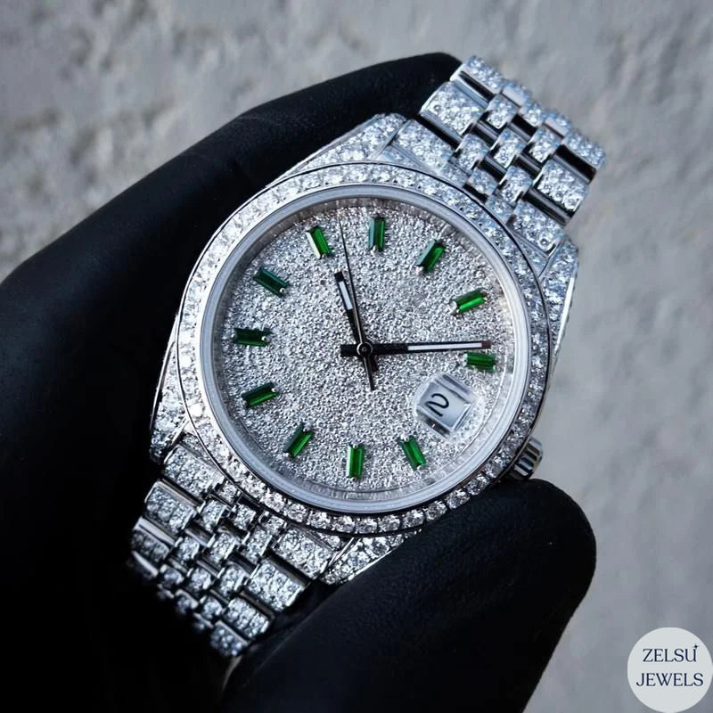 Exquisite silver diamond watch with green emerald diamond dial and polished design.