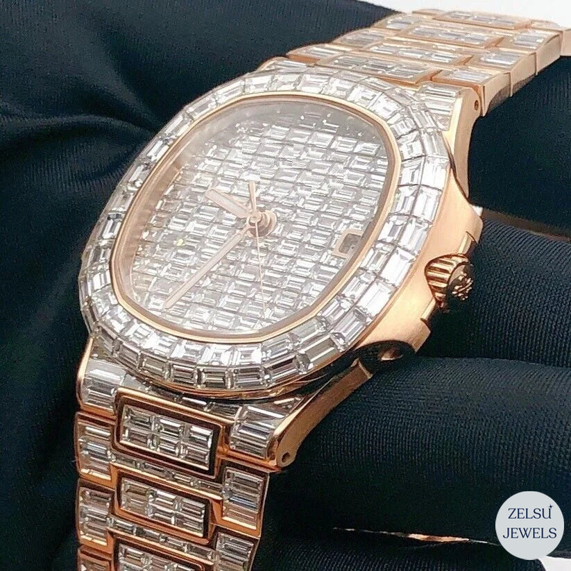 Elegant emerald diamond rose gold watch with full diamond detailing and radiant emerald accents.