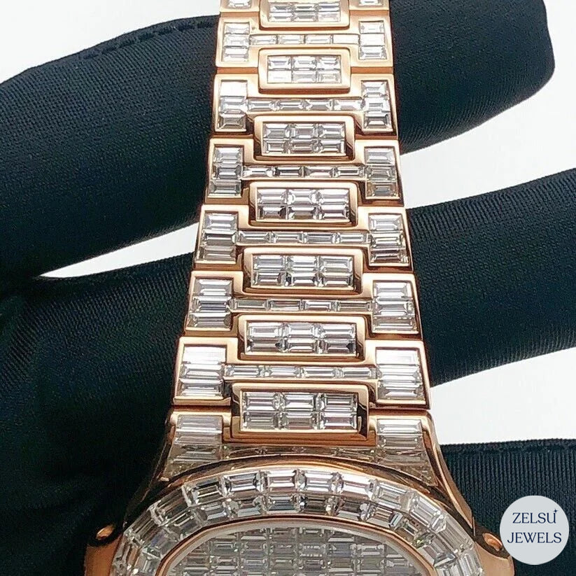 Rose gold emerald diamond bust-down watch, featuring high-quality emerald diamonds and exquisite design.
