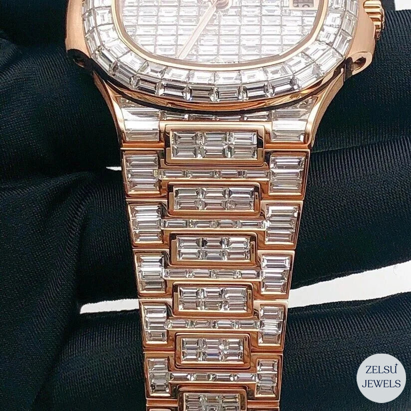 Opulent emerald diamond rose gold bust-down watch, combining emeralds with radiant diamonds for a luxurious look.