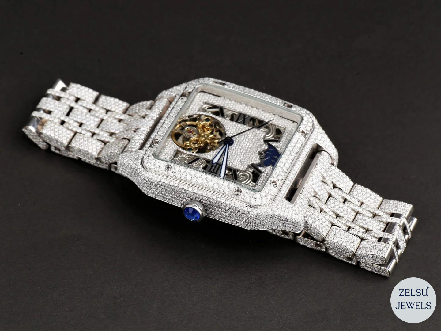 Luxury crystal watch featuring a vibrant blue crown and polished, sleek finish for a sophisticated look.