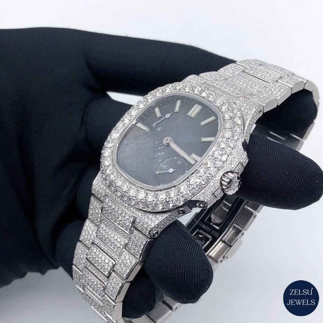 Blue crystal diamond watch with sub-dial and sparkling diamond bezel, offering timeless elegance and precision.