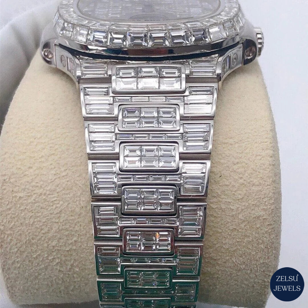 Sophisticated silver watch with emerald bezel and dazzling diamond bust-down design for a bold, luxurious look.