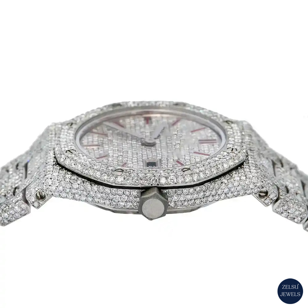 Silver diamond watch with vibrant red dial, offering a unique and luxurious timepiece.