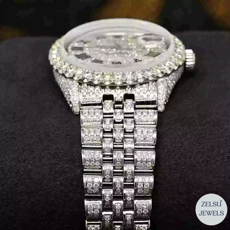 Silver Roman diamond watch with radiant diamonds and classic Roman numerals for a refined and luxurious design.
