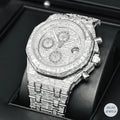 Silver automatic watch with stunning emerald diamonds, perfect for a bold and elegant statement.
