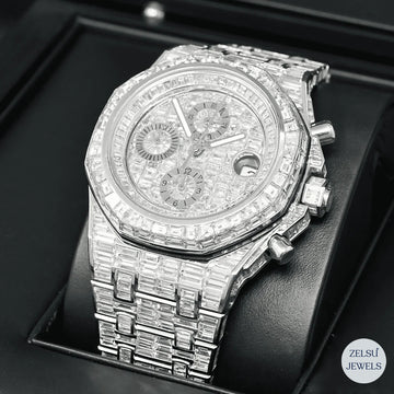 Silver automatic watch with stunning emerald diamonds, perfect for a bold and elegant statement.