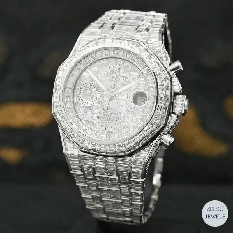 Luxury silver automatic watch with emerald diamond accents, combining style and precision.