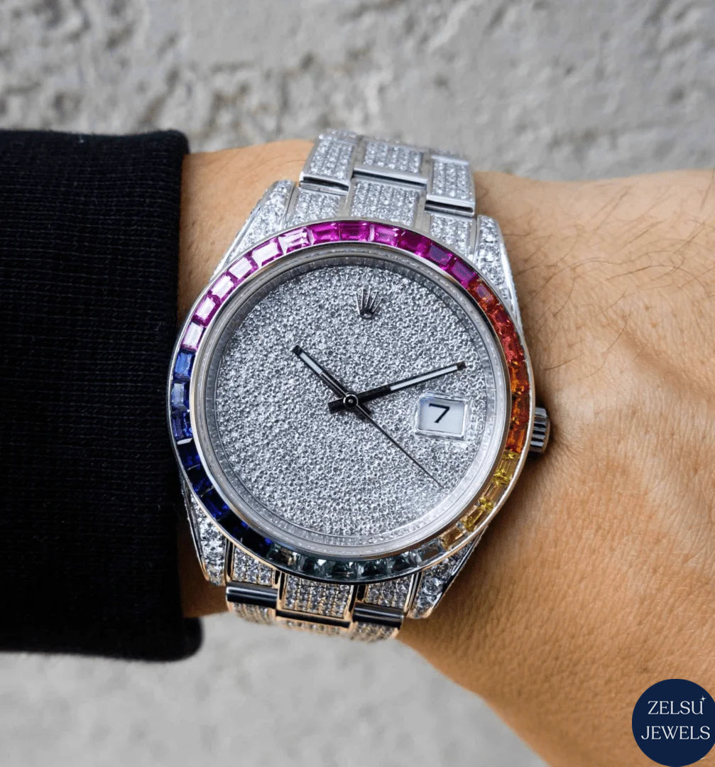 Luxury silver diamond watch featuring a dazzling rainbow bezel, offering a unique and vibrant design.