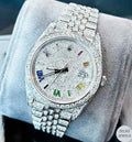 Luxury silver diamond watch with a vibrant rainbow dial, combining elegance with a colorful display.