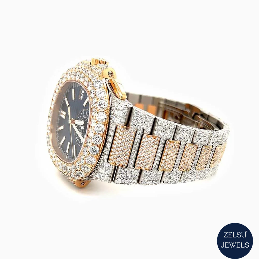 Luxury wrist watch with blue crystal, rose gold, and diamond accents, offering both elegance and bold style.