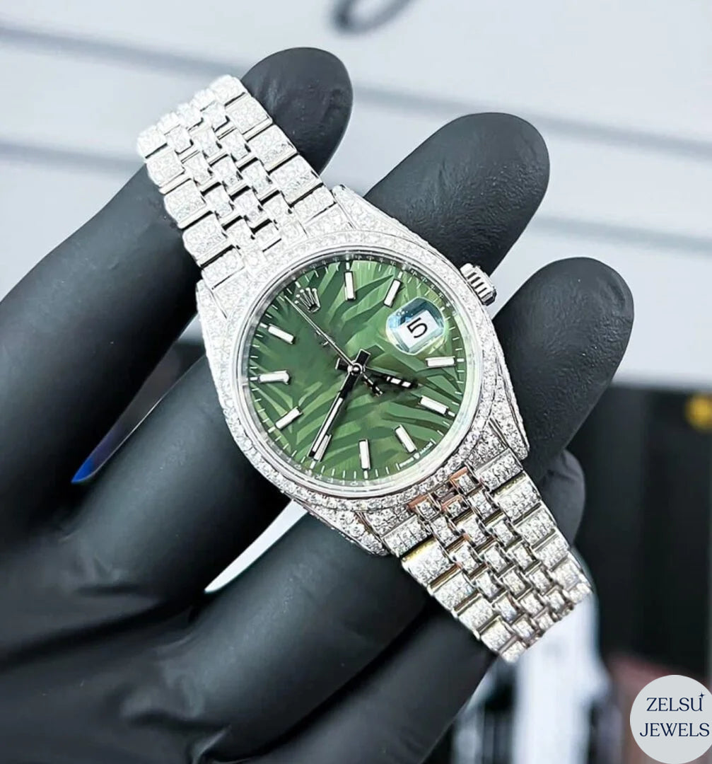 Luxury Rolex-inspired silver diamond watch featuring a rich green dial and sparkling diamonds.