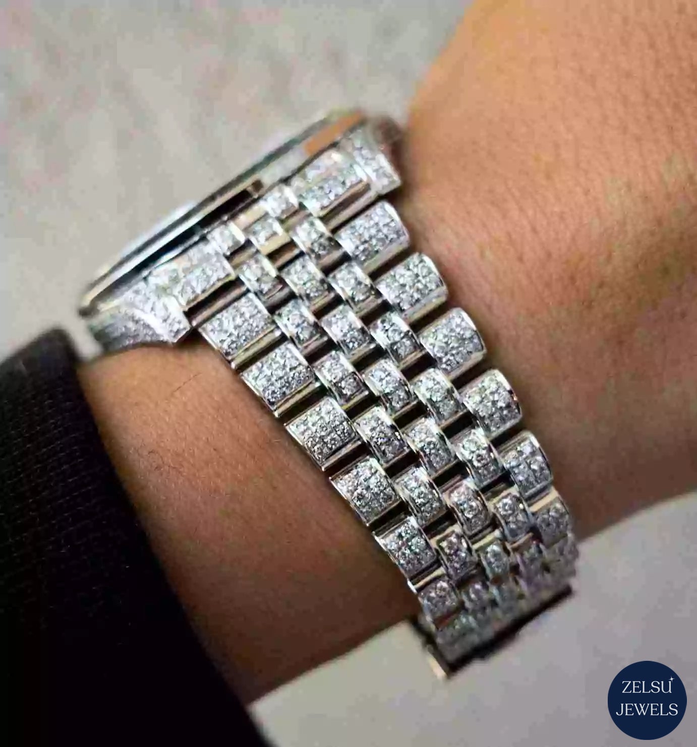 Silver moissanite diamond watch with a radiant rainbow bezel, enhanced with VVS clarity diamonds for a dazzling design.