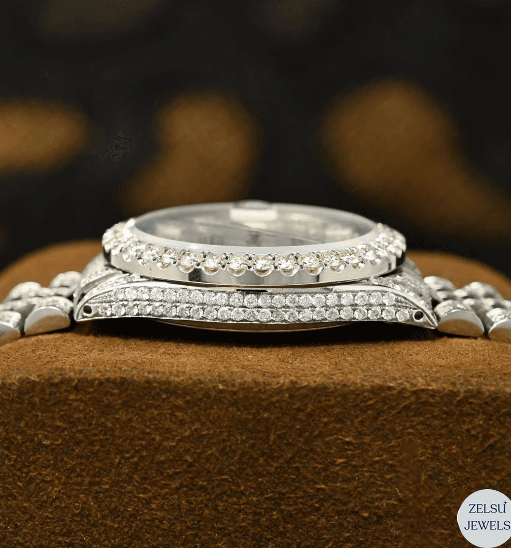Stunning silver moissanite diamond watch with a unique red crystal dial, enhanced by radiant diamonds for a striking look.