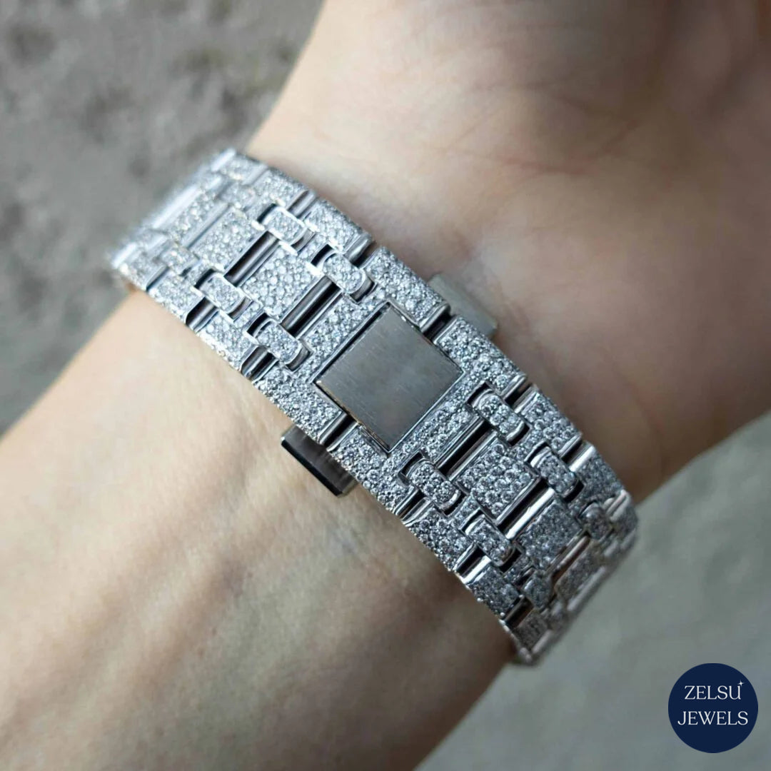 Luxury silver watch with a striking black crystal dial, offering both classic style and modern elegance.