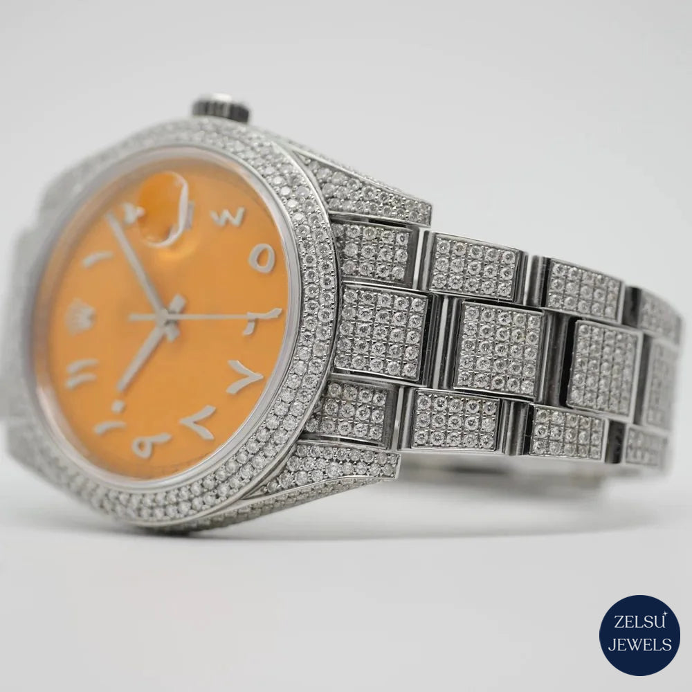 Luxury silver diamond watch featuring a stunning orange crystal dial and a radiant diamond bezel for a high-end look.