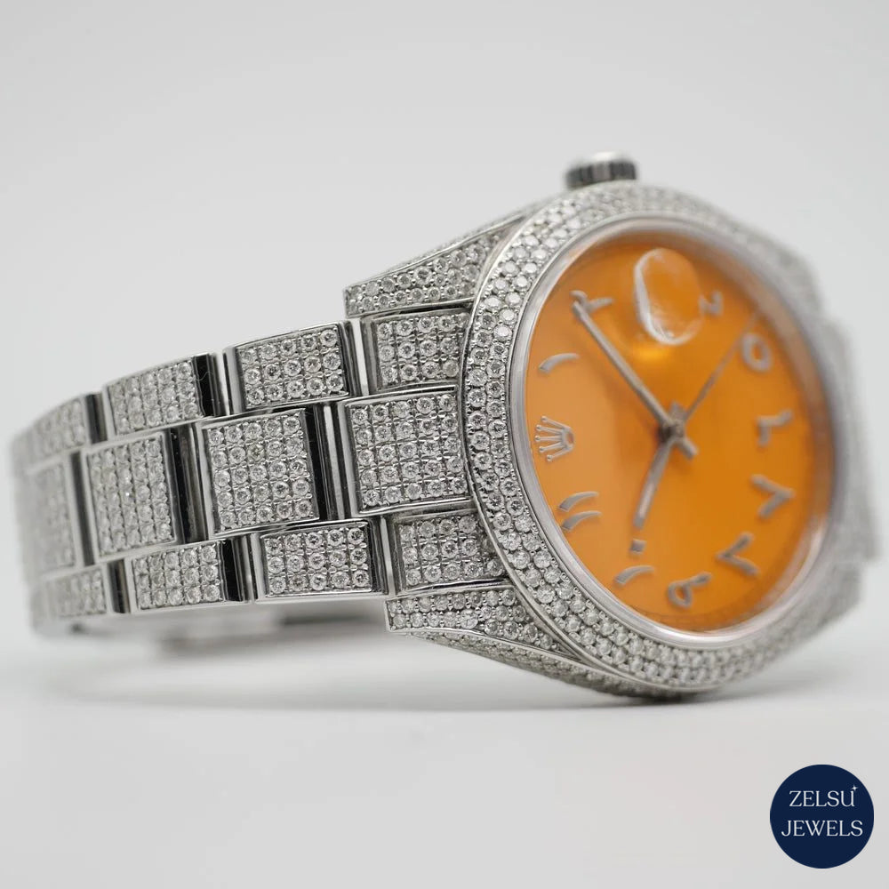 Exquisite silver diamond watch with an eye-catching orange crystal dial and radiant diamond bezel, perfect for any occasion.