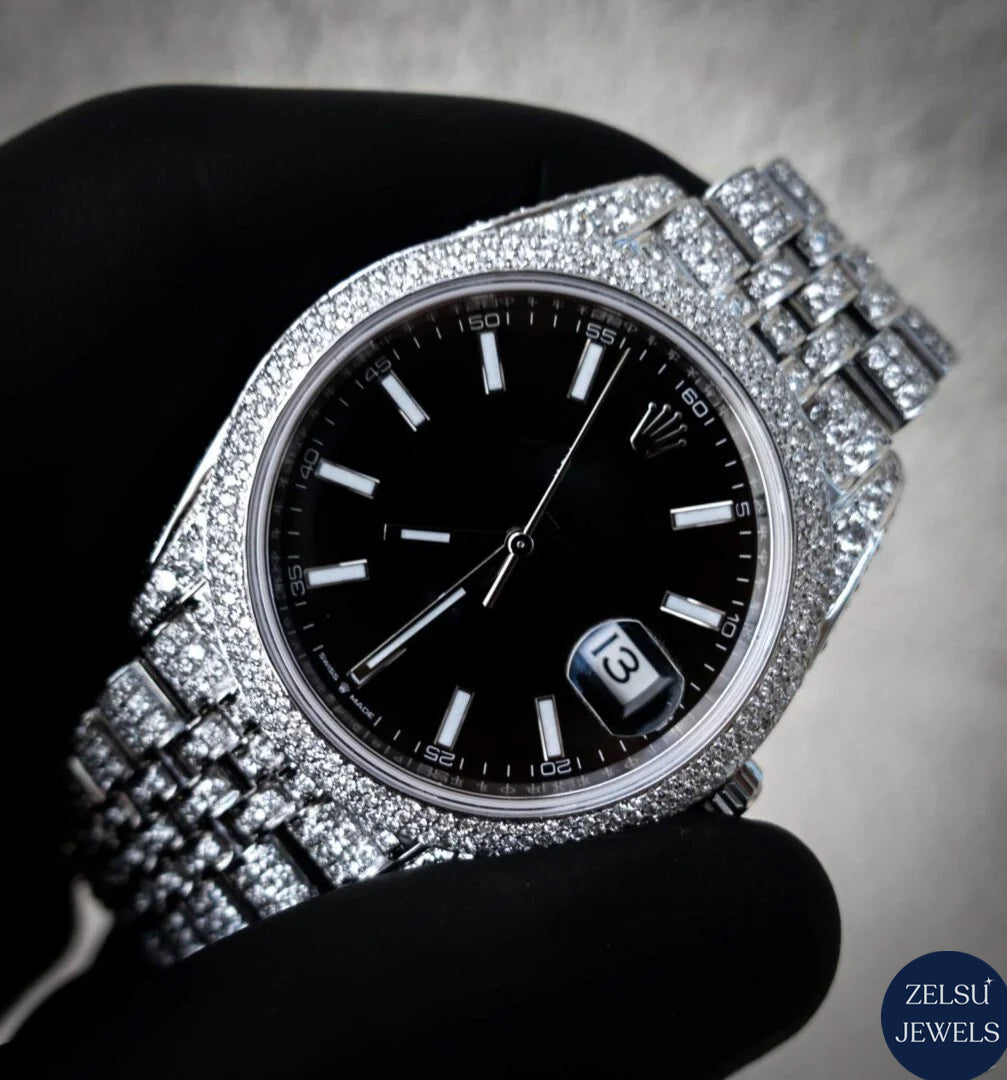 Silver diamond watch with a sleek black crystal dial, featuring brilliant diamonds for a timeless luxury accessory.