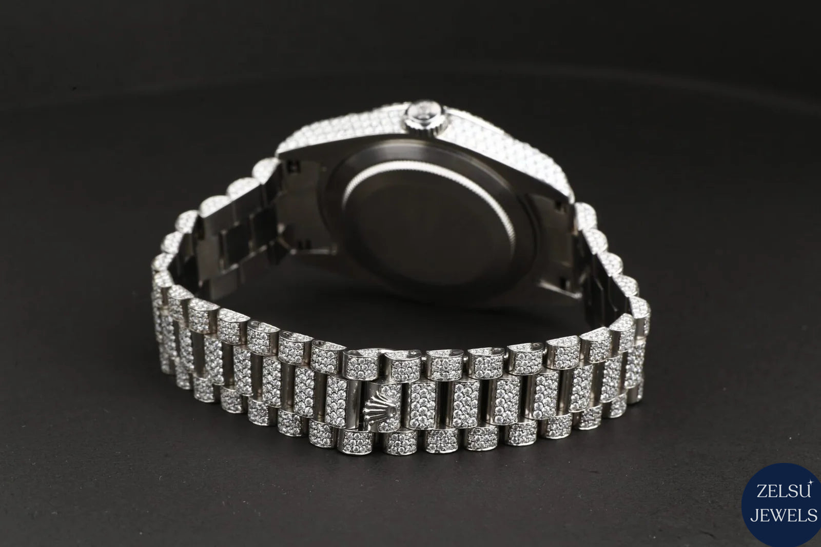Sophisticated Rolex silver bust-down diamond watch, featuring radiant diamonds for an elevated, high-end look.