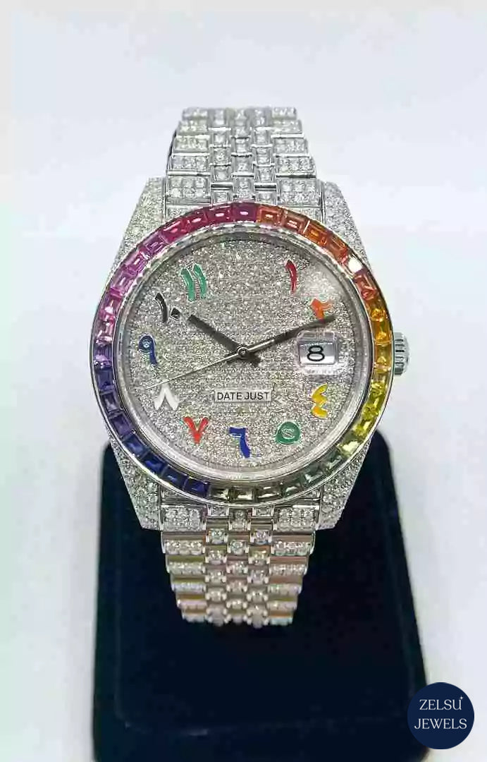 Stunning silver diamond watch with a vibrant rainbow dial and bezel, combining luxury and bold design.