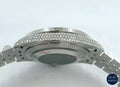 Sophisticated silver diamond watch with rainbow dial and bezel, offering both elegance and a bold pop of color.