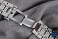 Roman dial bust-down watch with radiant diamonds, offering a luxury design with classic appeal and modern brilliance.