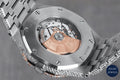 Elegant bust-down watch with Roman numeral dial and sparkling diamonds, perfect for those seeking a luxurious timepiece.