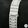 Exquisite bust-down diamond watch with a striking blue diamond crown bezel, offering both sophistication and style.