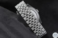 Silver diamond watch with a dazzling rainbow dial, ideal for those who appreciate vibrant luxury and style.