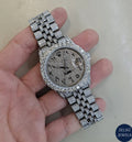 Rolex-style silver diamond watch with sparkling diamonds and sophisticated design.
