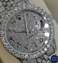 Silver Rolex-style diamond watch with radiant diamonds and polished design for a luxurious look.