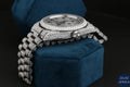 Luxury Rolex silver bust-down diamond watch with sparkling diamonds, perfect for fashion-forward individuals.