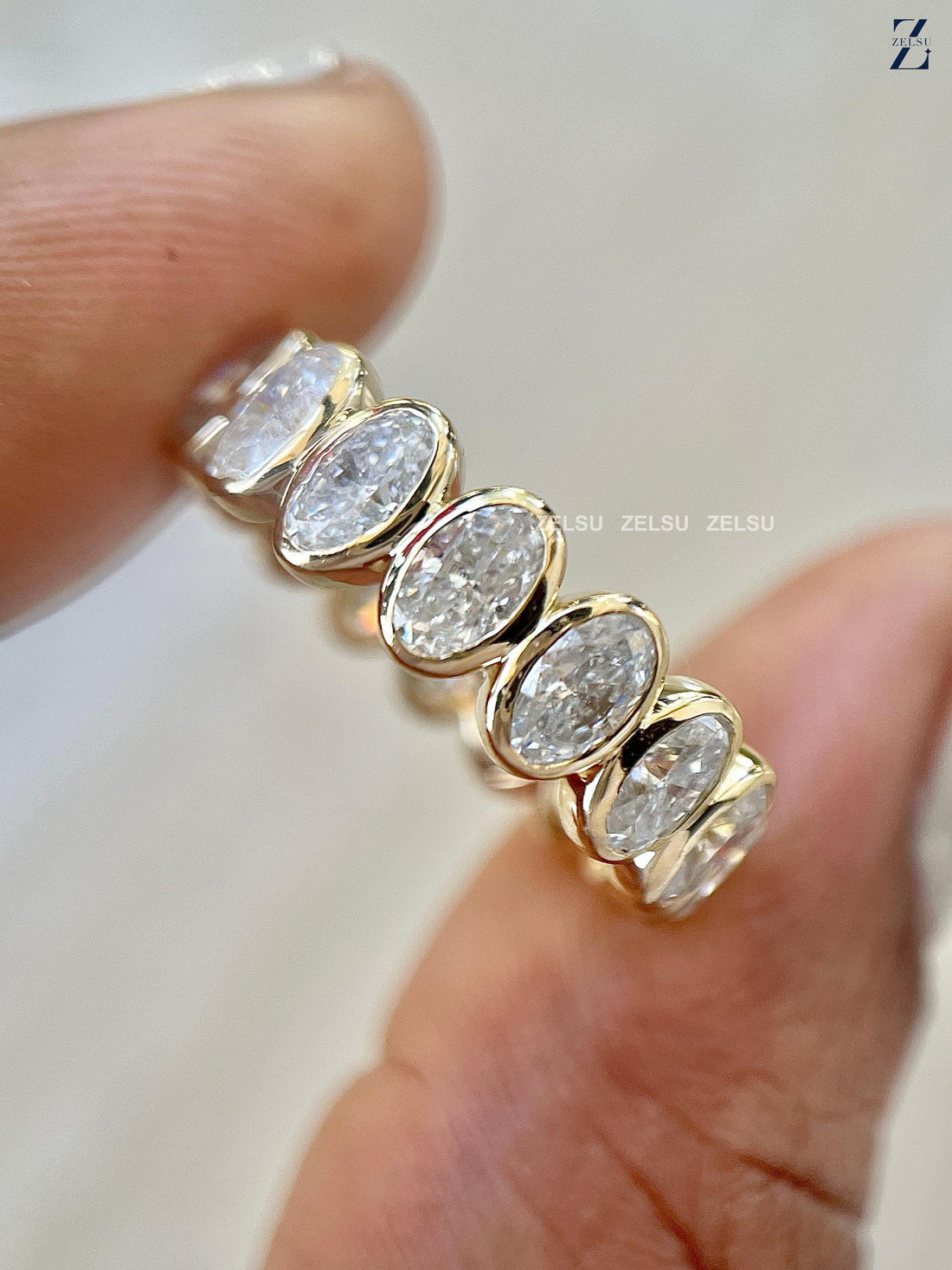 Bezel Set Oval Moissanite Wedding Band - Full Eternity Gold Ring